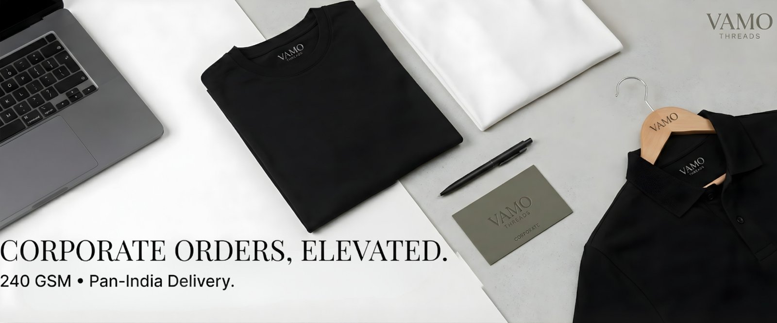 Bulk corporate T-shirt order samples arranged on a minimal desk with GST-ready billing aesthetic.